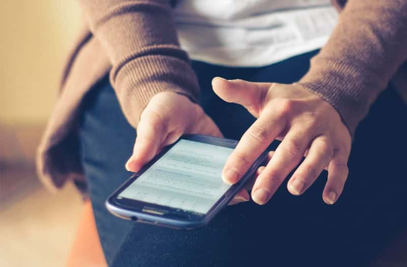 Lady using her phone to search for files