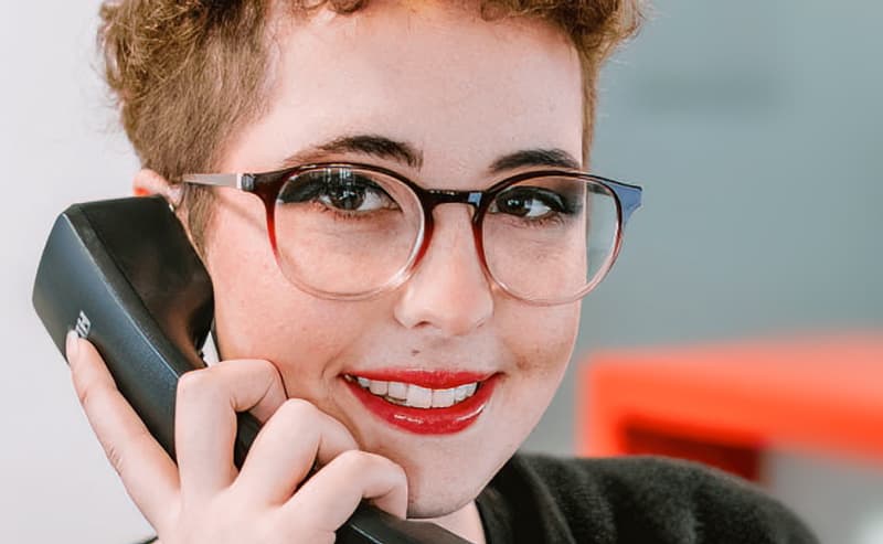Woman smiling when on phone call